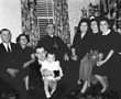 1956 - Bishop Bonhomme at 53 Tremont St with Andre Paquette, Noella and Josephat Lacasse (holding), Stella Paquette, Stella G. Paquette, Bea Small and Rowella Goeffroy